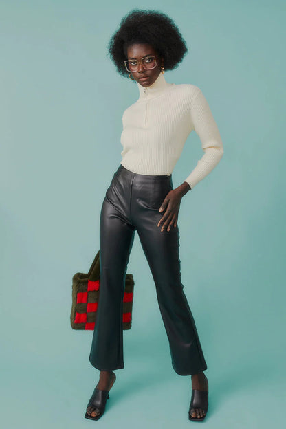 Fitted ribbed funnel neck jumper styled with leather trousers