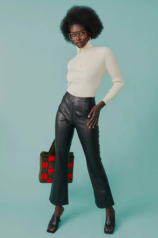 Fitted ribbed funnel neck jumper styled with leather trousers