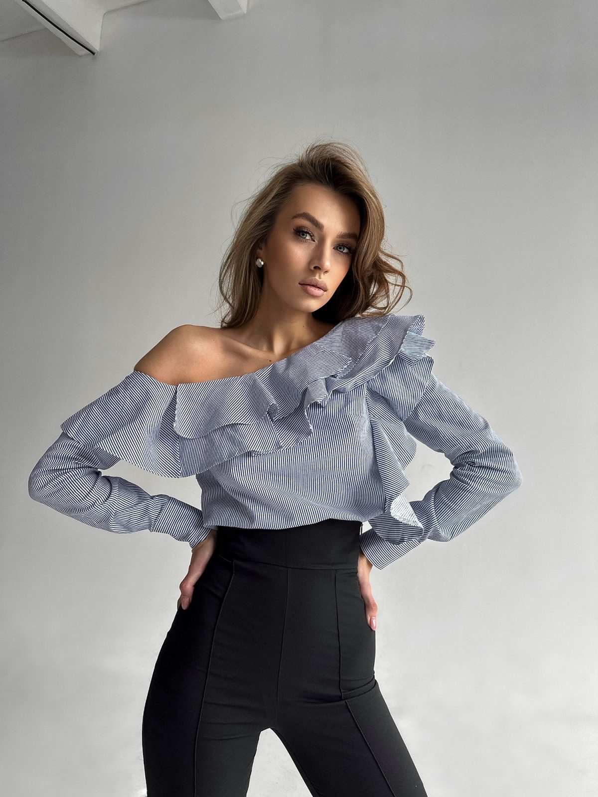 Ruffle detail on Symphony striped asymmetric blouse