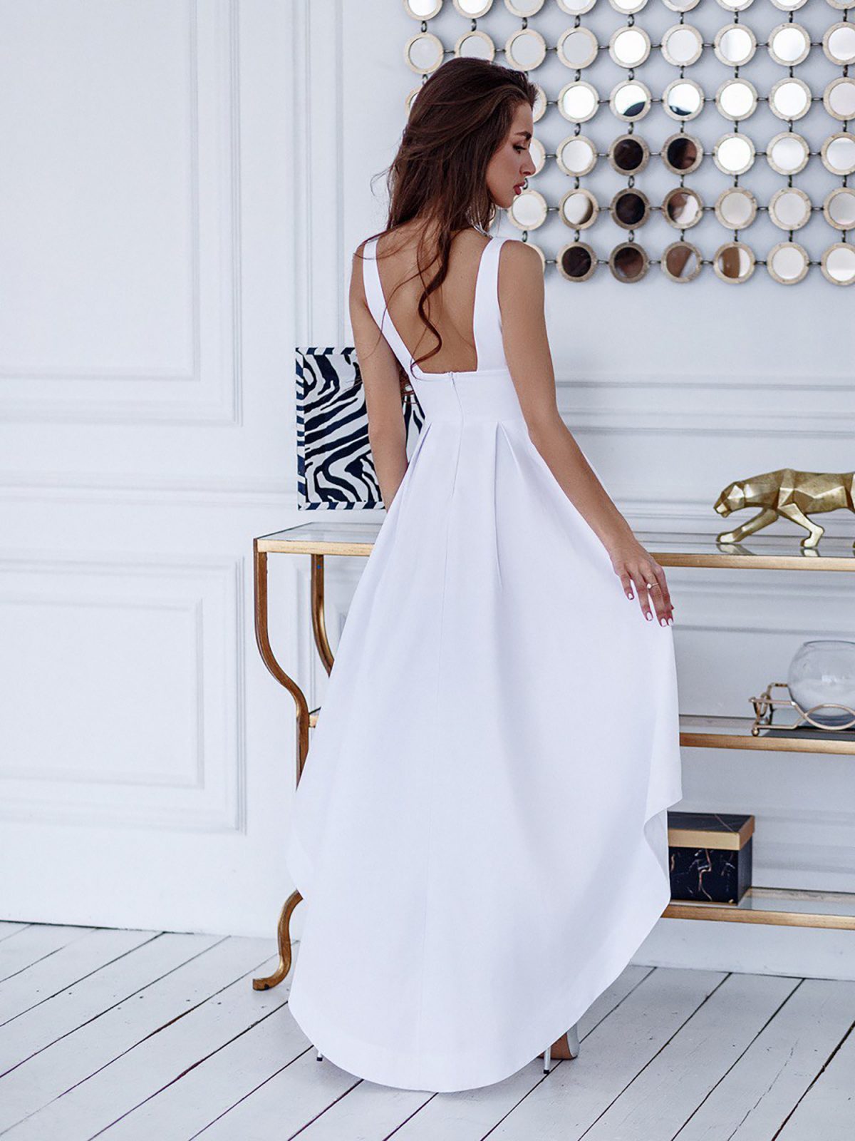 Open back and asymmetric hem detail on Aria gown