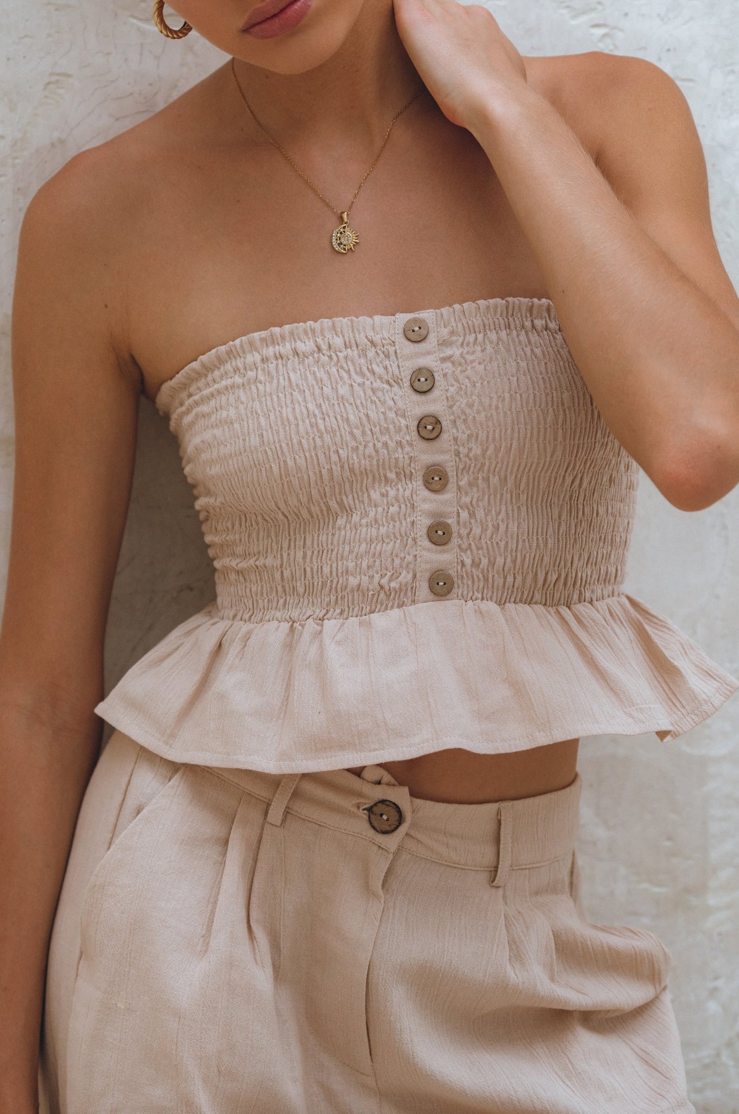 Wooden button detail on natural salt shirred linen bandeau